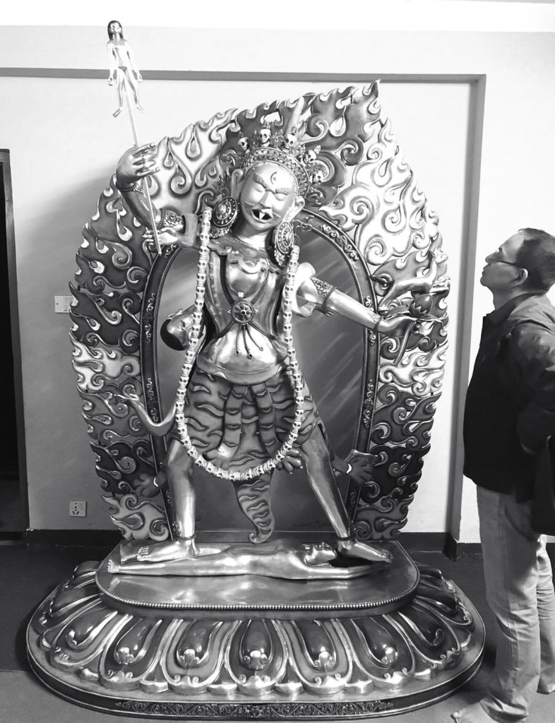 Founder with Ekajati statue